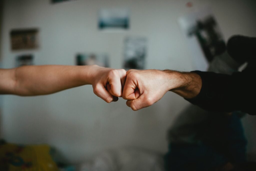 AC Repair in Wellington, West Palm Beach, Boca Raton and the surrounding area. A photo of two people bumping fists.