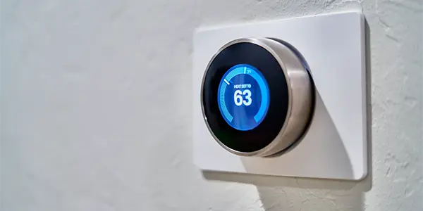 Now Air Conditioning | HVAC Services in Wellington, FL and the surrounding areas. A Nest thermostat displays 63 degrees.