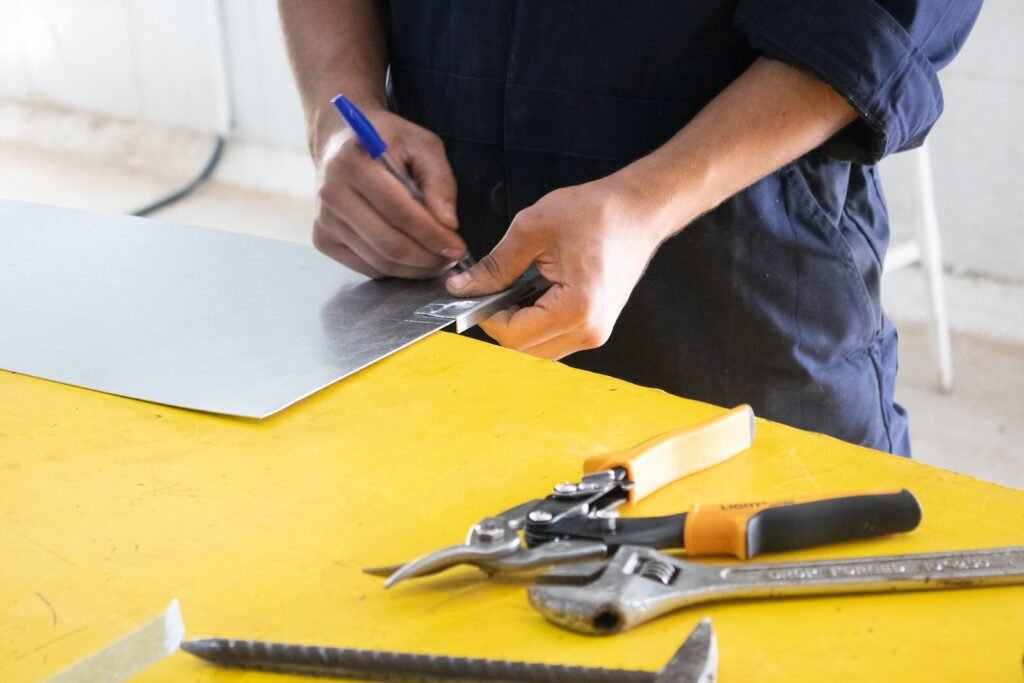 Now Air Conditioning HVAC Services in Wellington, FL and Surrounding areas. A person measuring on a yellow table.