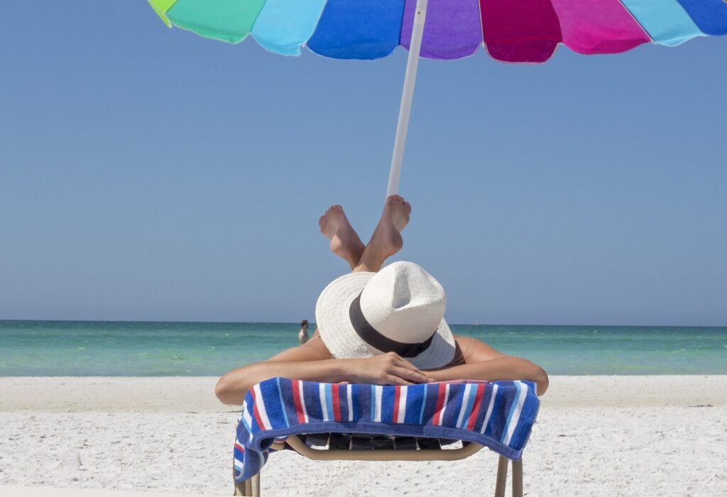 Now Air Conditioning | Heating Repair in Wellington, West Palm Beach, Boca Raton and the surrounding area. A photo of a person relaxing on the beach.